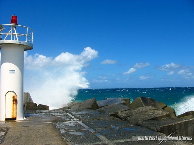 Waves crashing over the end of the rocks