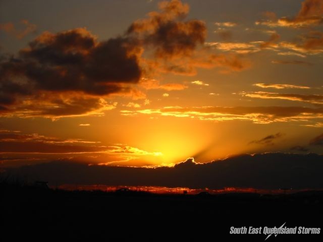 Cumulus on the horizon being lit up