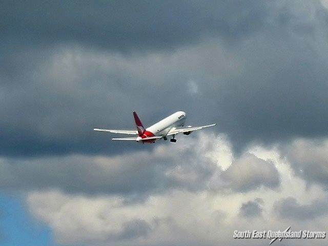 Qantas going towards cumulus clouds