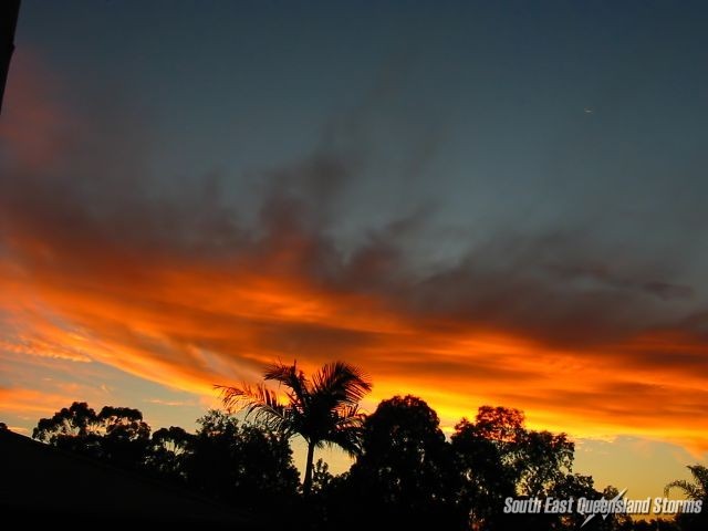 Mid level cloud being lit up orange