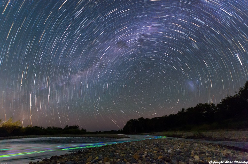 26 minutes worth of startrails - stacked using startrails program.  ISO800 F3.5.  The light trails in the river are glowsticks