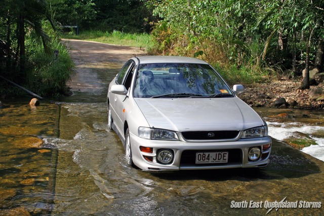 Jezza in the water coming back through a water crossing